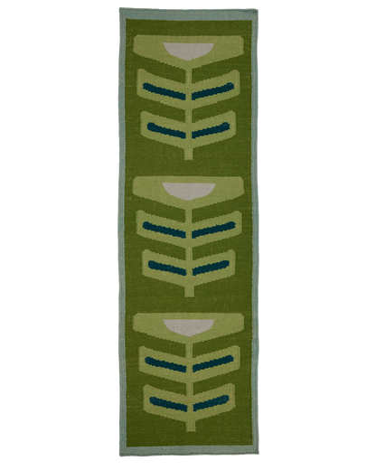 A pterapod grass runner with a retro mid-century modern design, featuring three stacked stylized leaf motifs in olive green, light green, teal, and cream, bordered by a light blue-green edge.