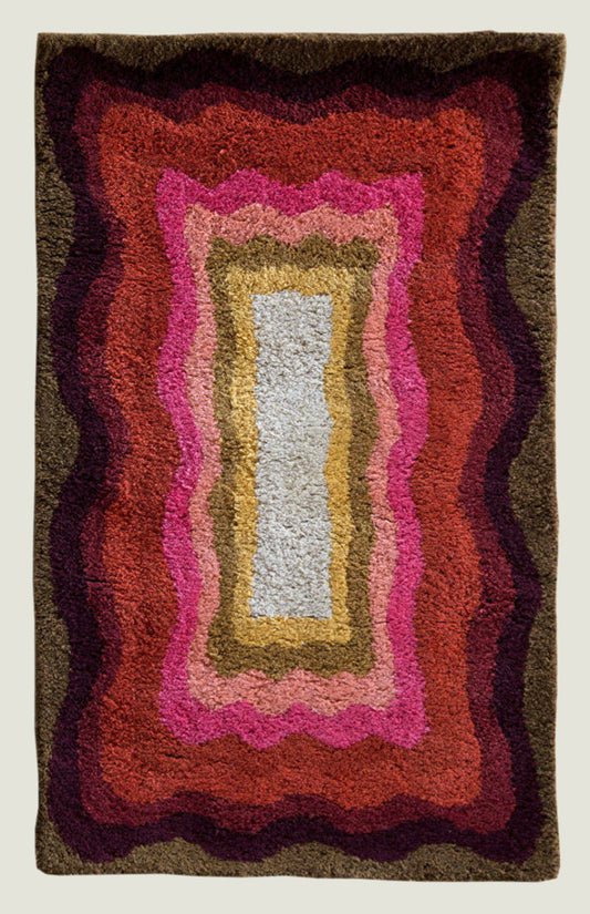 Alden Sunset wool area rug by Angela Adams in warm sunset tones