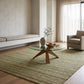 aa x Chilton Design 3 Colorway C rug in a serene, minimalist living room with a glass coffee table and neutral decor.