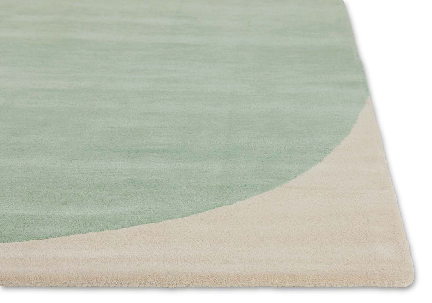 A close up corner of angela adam's Shine Collection, Dove Dream modern area rug
