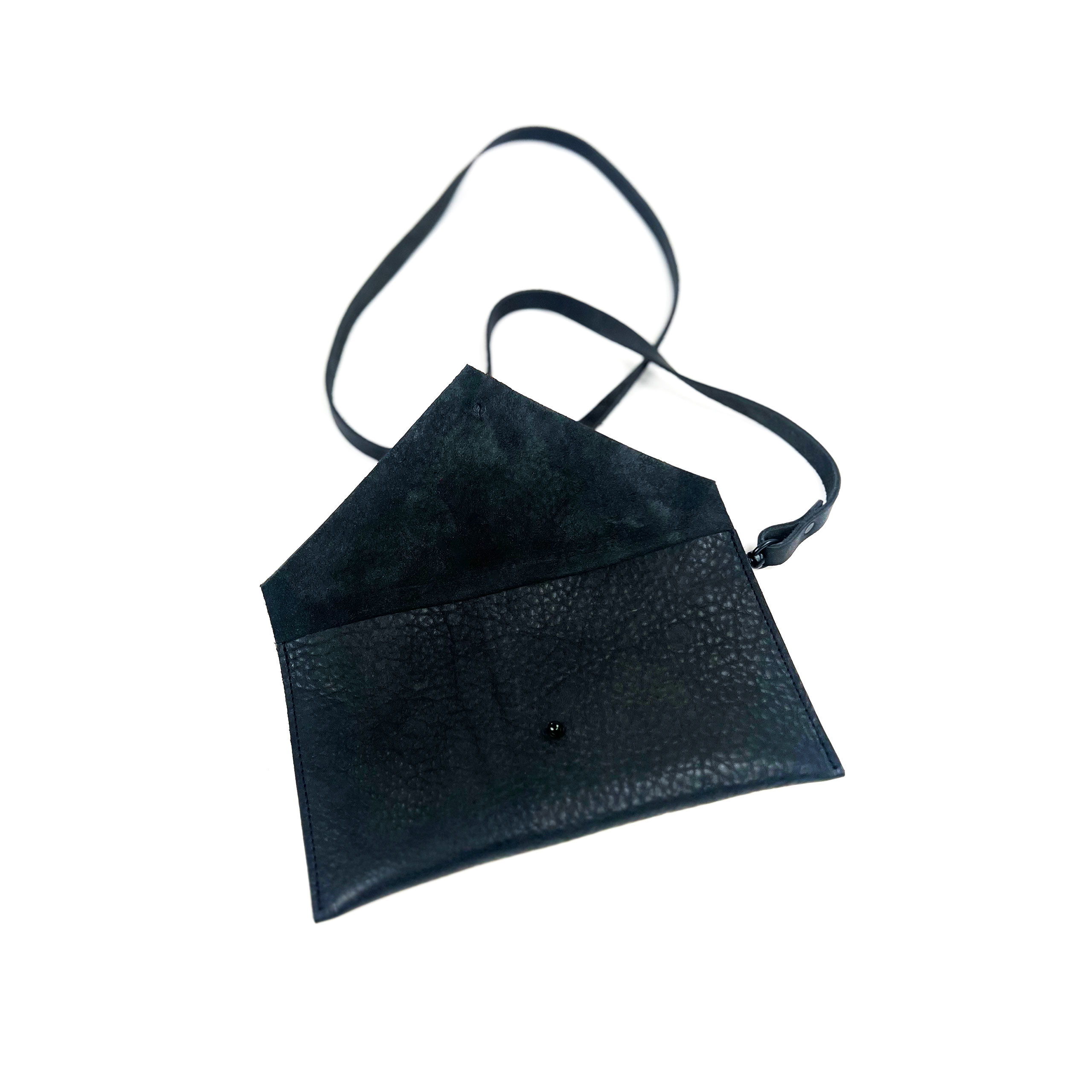 A black leather shoulder bag with open front flap, isolated on a white background.