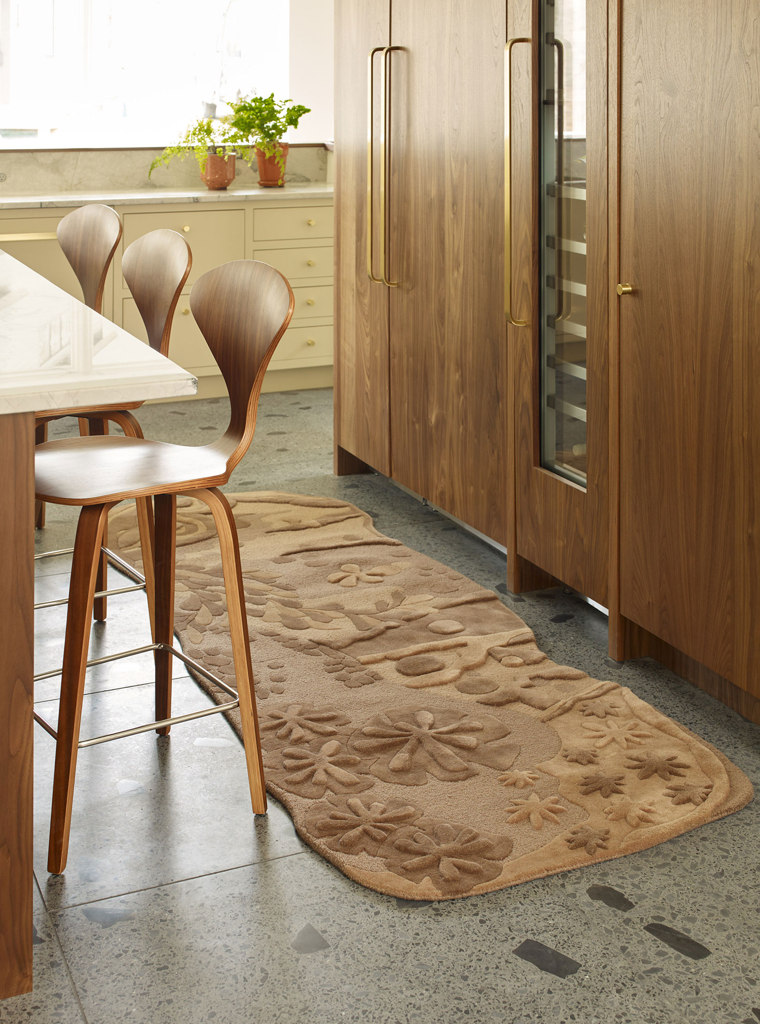 A soft brown and tan runner rug by Angela Adams called Eden Dove