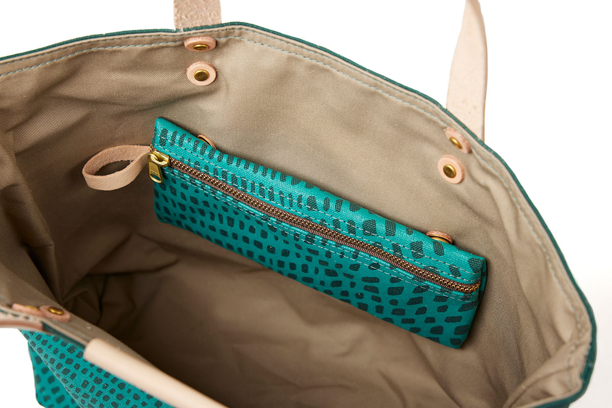Inside of Dark green and teal colored tote by Angela Adams