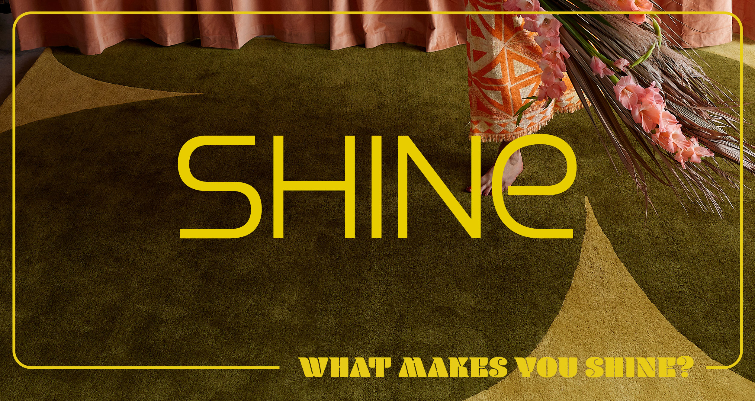 A modern rug in green tones with yellow type on top saying, Shine, What Makes You Shine?