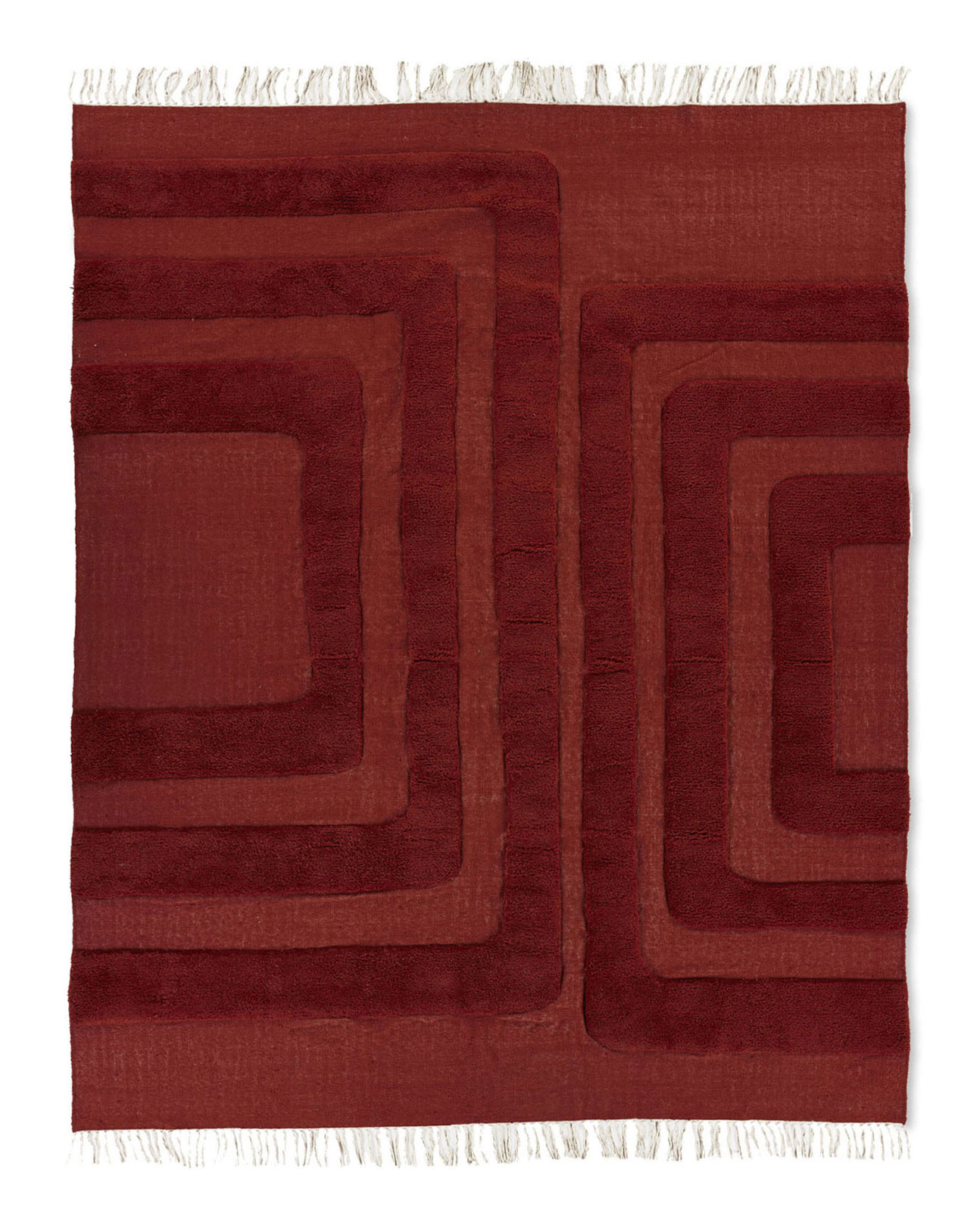 Woven deep red area rug with tufted organic archways and fringe.