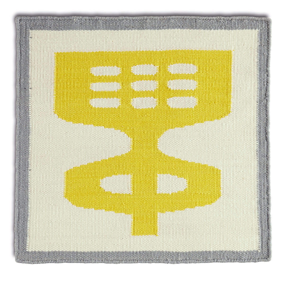 An abstract yellow and gray rug.