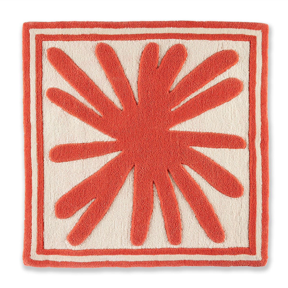 An abstract coral colored rug.