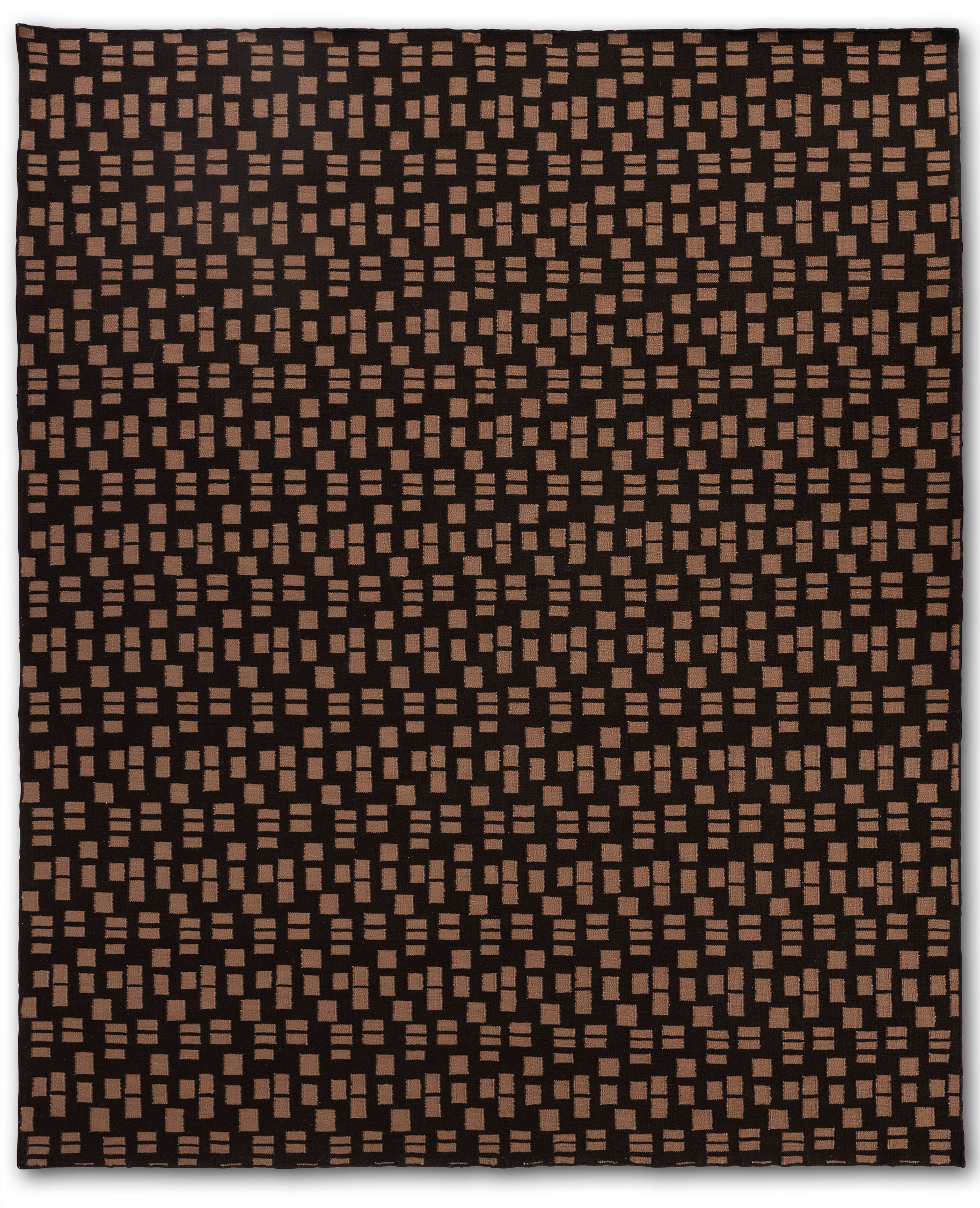 A close up of a jute area rug with tan rectangle patterns on a dark brown background.