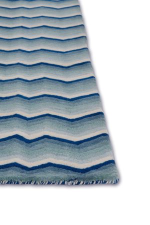 A detail of a modern area rug in blue tones called Buzz Blue