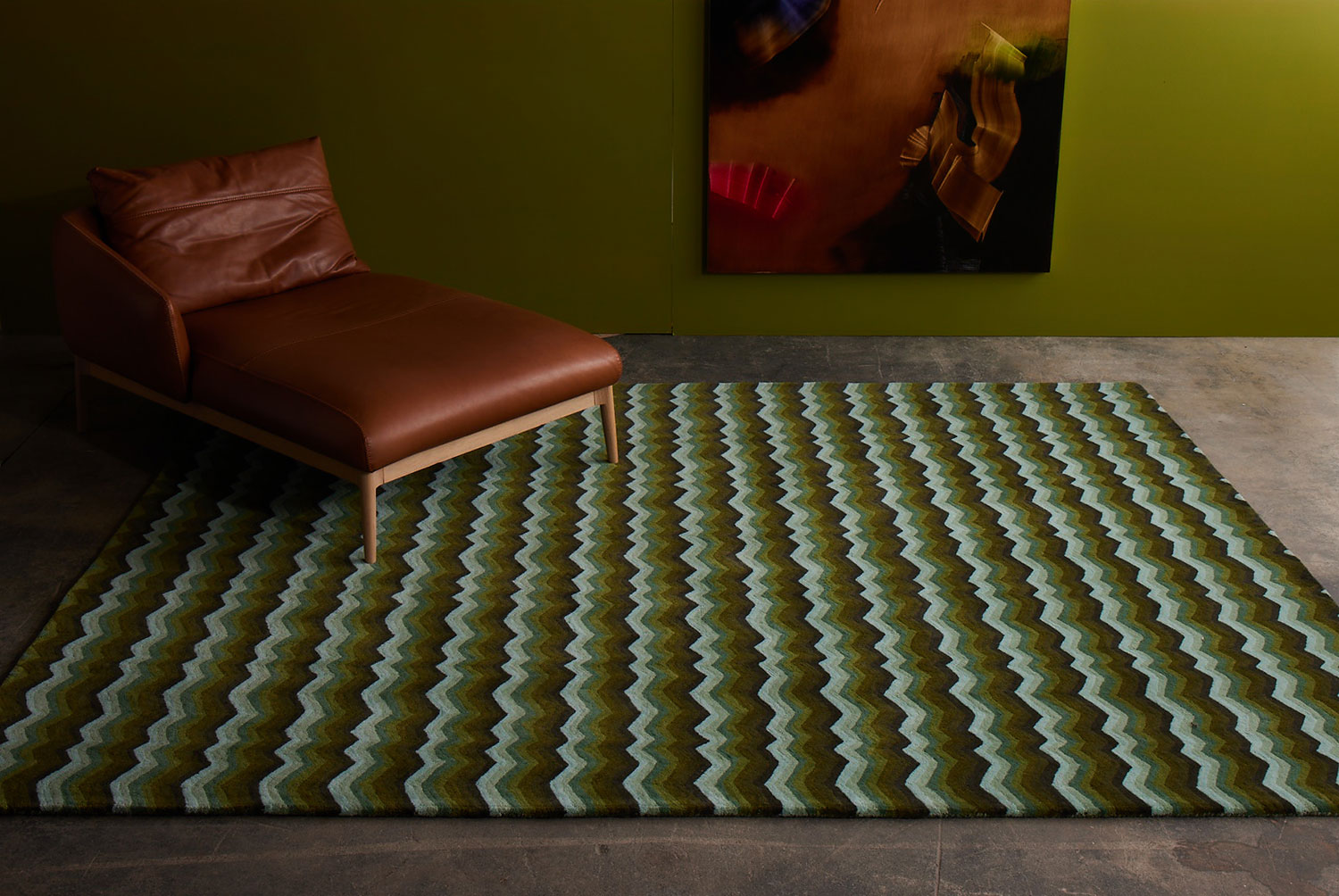 A modern area rug in green tones in a green room called Buzz Emerald