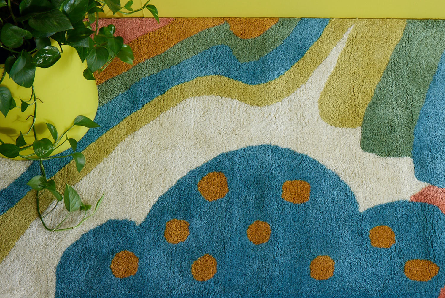 A multi-colored, modern area rug by Angela Adams called Daytrip Happy