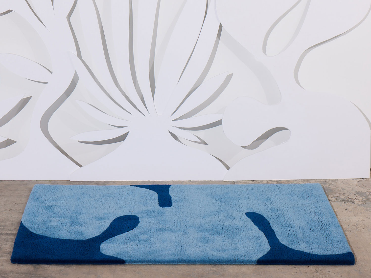 Astrud Splash area rug in a white room by Angela Adams
