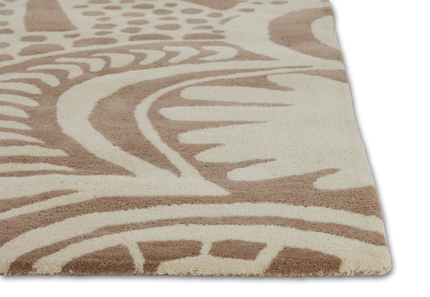 An alternate corner detail of a neutral colored, modern area rug called Storybook by Angela Adams