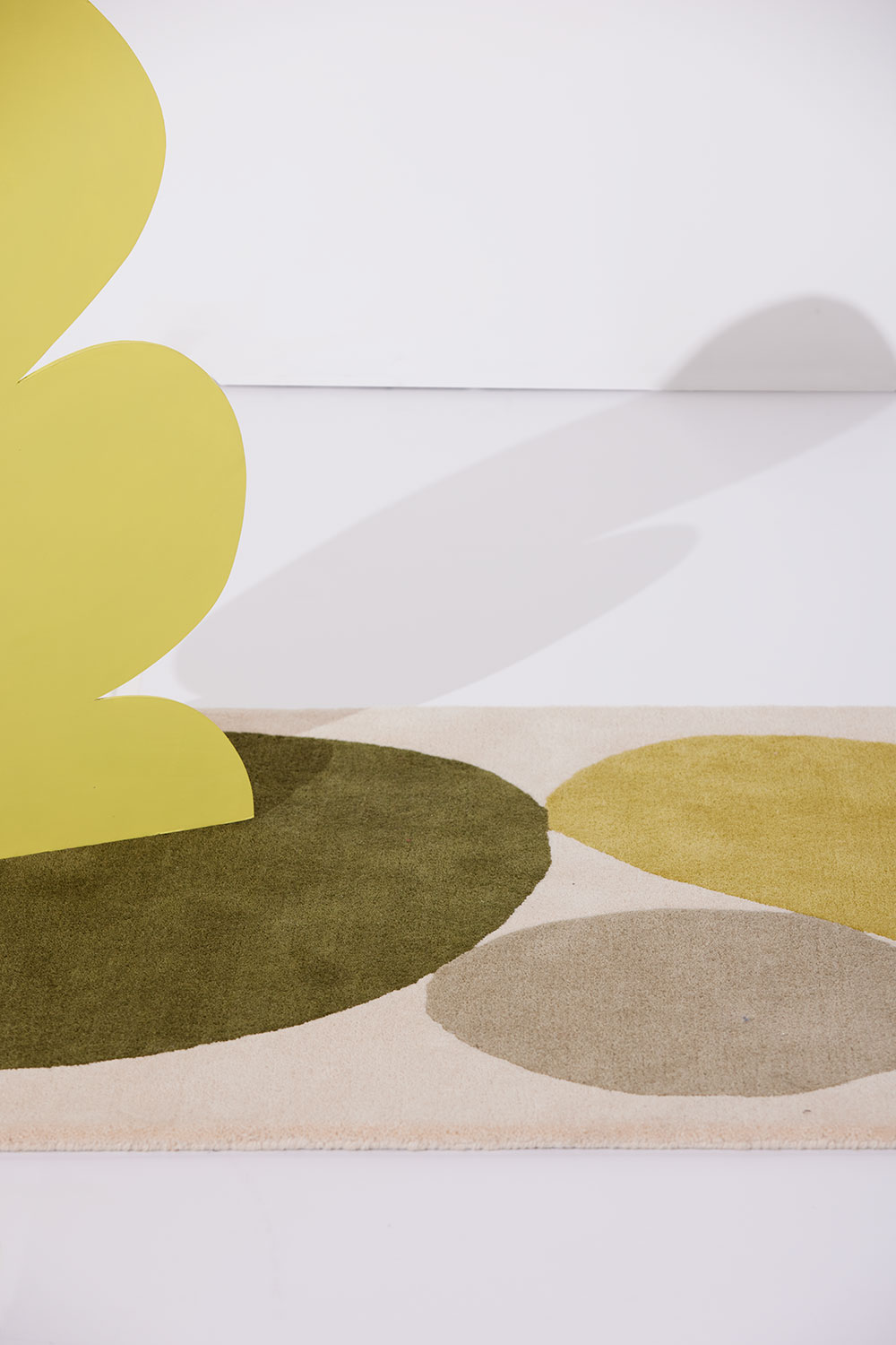 A cropped look at a 3 foot by 5 foot modern rug called Three Stones Moss