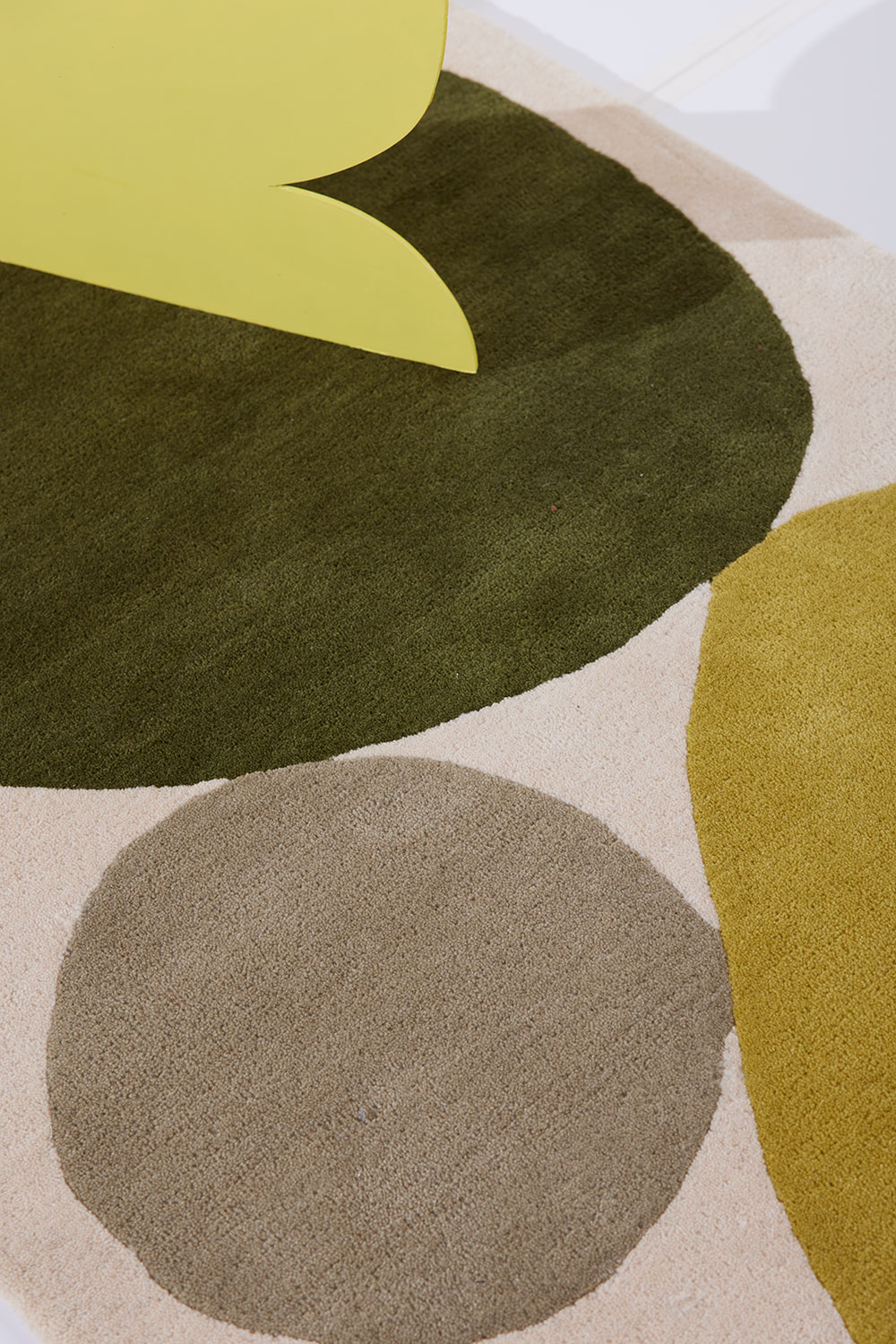 A close up look at a 3 foot by 5 foot modern rug called Three Stones Moss