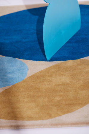 A close up of a 3 foot by 5 foot modern rug called Three Stones Sand