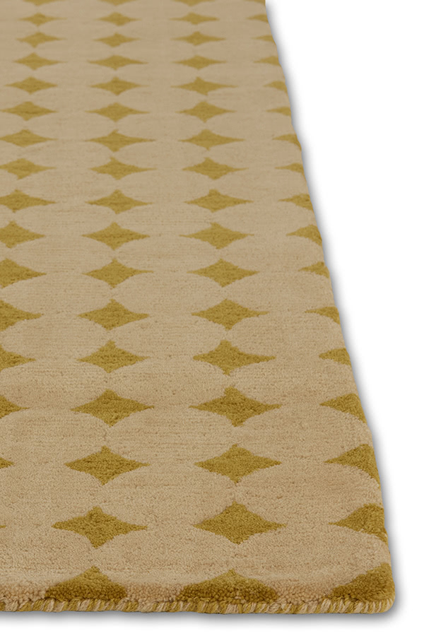 A close up corner of a yellow area rug called Bongo Lemon