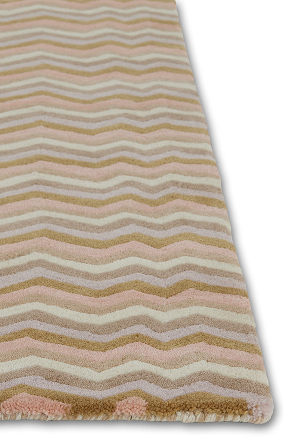 A detail of a modern area rug in cream tones called Buzz Dream