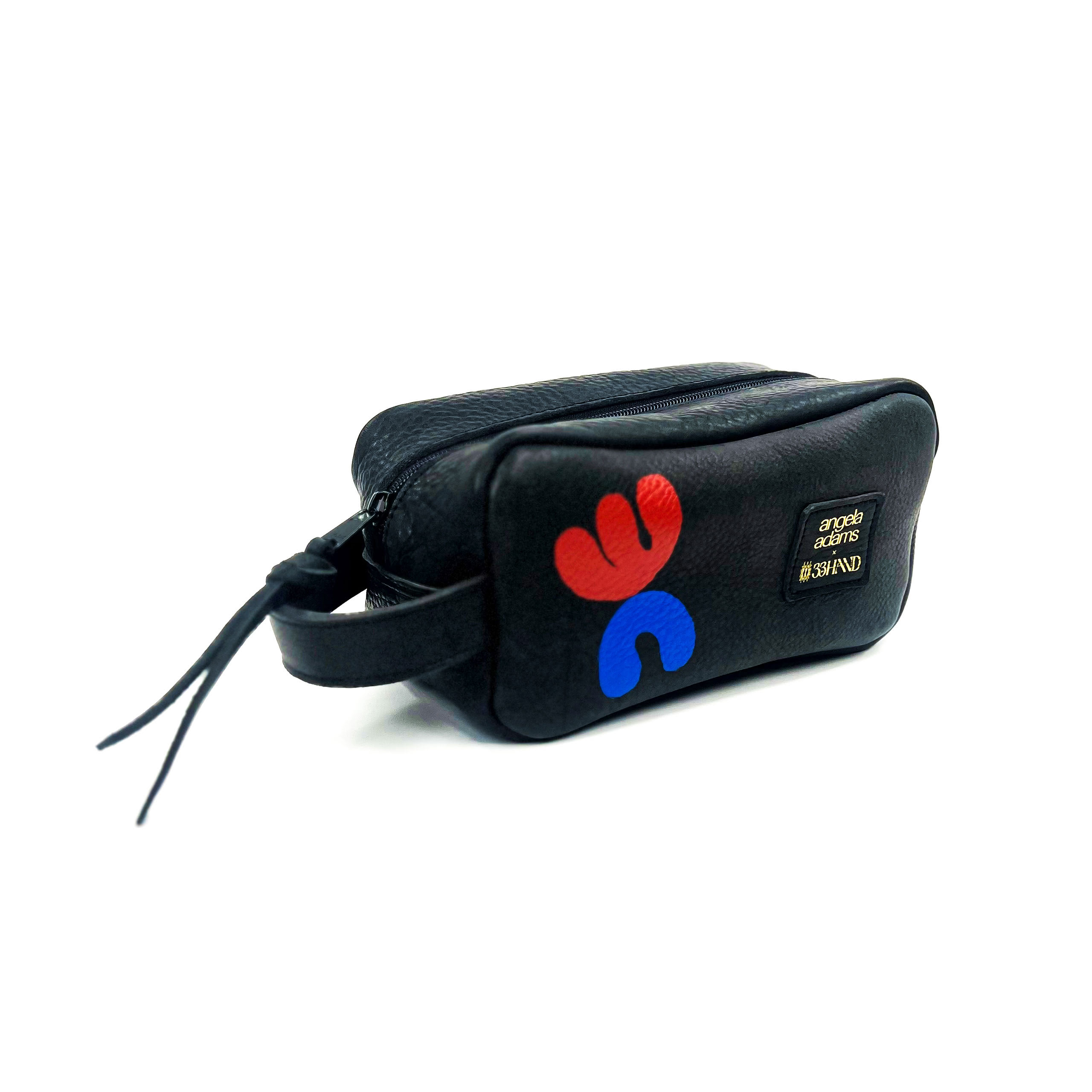 Black cosmetic bag with a red and blue handprint logo and text on the side, positioned against a white background.