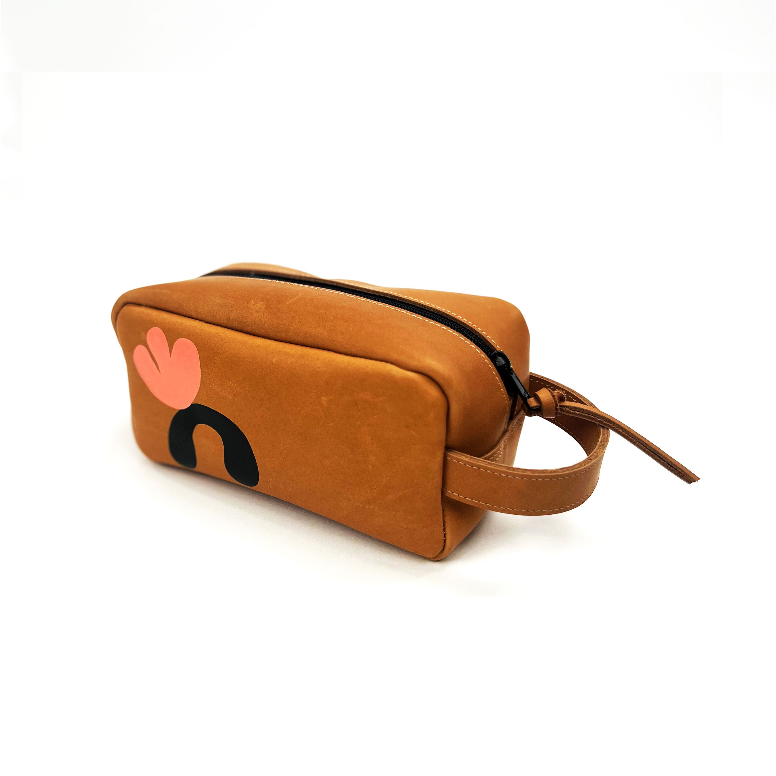 Brown and tan cosmetic bag with a peach handprint logo and text on the side, positioned against a white background.